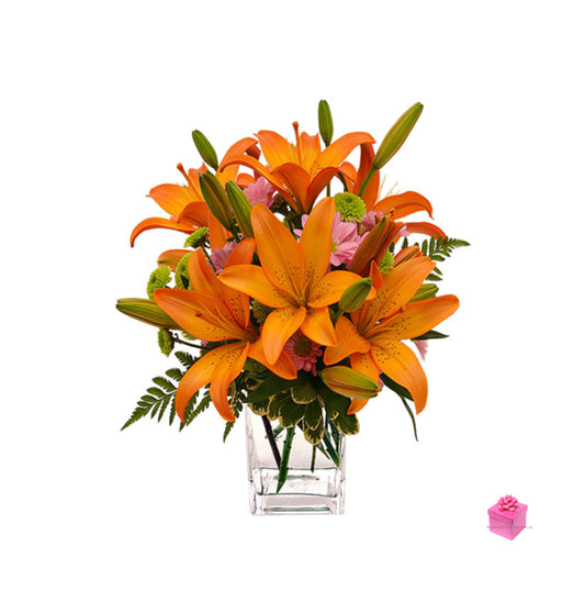 Bouquet exótico de lirios holandeses Bon Bini con florero de cristal a cualquier parte de Colombia Envía este Elegante Bouquet de Flores naranja, Rosas, gerberas, lirios holandeses y follaje a domicilio en Colombia.